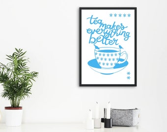 May include: A black framed print with a white background and blue text that reads "tea makes everything better". The text is in a handwritten style. A blue illustration of a teacup and saucer with two birds perched on the rim is below the text.
