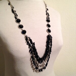 Long multi-strand Necklace with black feather chain and silver tones