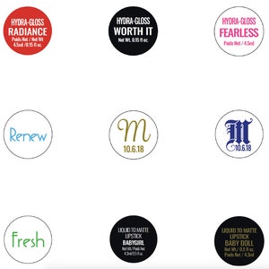 May include: A set of seven round stickers with various designs and text. The stickers include the words "Hydra-Gloss Radiance", "Hydra-Gloss Worth It", "Hydra-Gloss Fearless", "Renew", "Fresh", "M 10.6.18", and "M 10.6.18". The stickers are in various colors, including red, black, white, blue, green, and gold.