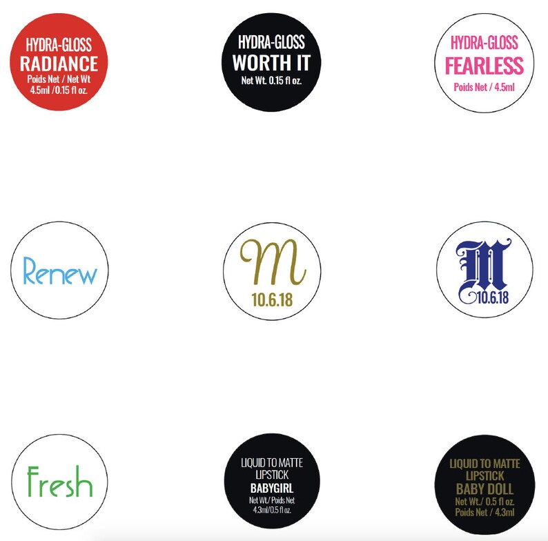 May include: A set of seven round stickers with various designs and text. The stickers include the words "Hydra-Gloss Radiance", "Hydra-Gloss Worth It", "Hydra-Gloss Fearless", "Renew", "Fresh", "M 10.6.18", and "M 10.6.18". The stickers are in various colors, including red, black, white, blue, green, and gold.