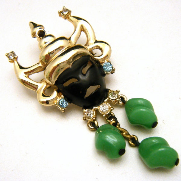 Vintage Rhinestone Black Enamel Mask Pin Green Glass Drops Brooch Gold Tone