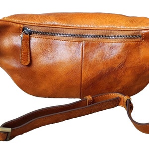 Stylish tan leather fanny bag equipped with two zippers for easy access and secure storage