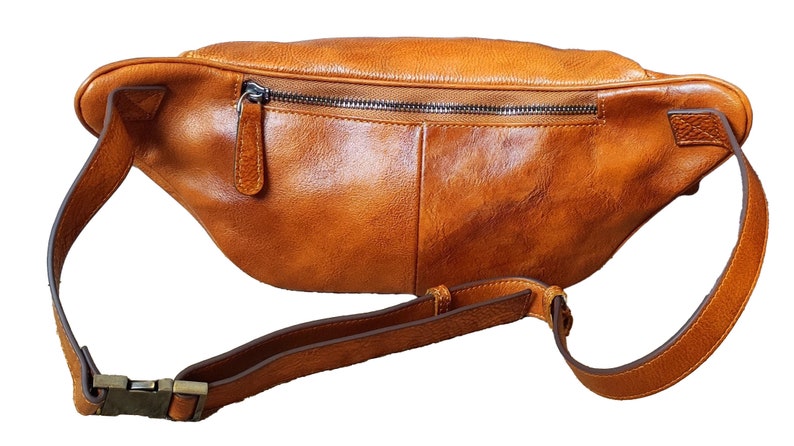 Stylish tan leather fanny bag equipped with two zippers for easy access and secure storage
