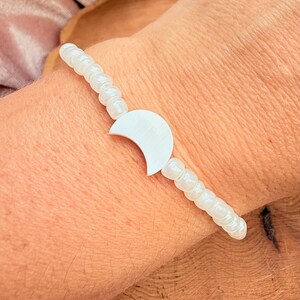 Celestial Theme Bracelet White Bead Collection Moon Shell Design Beach Style Essential Boho Fashion Element Stretch Band Construction Multiple Size Options Beautiful Casual Wear Piece Natural Fashion Detail Everyday Style Accessory