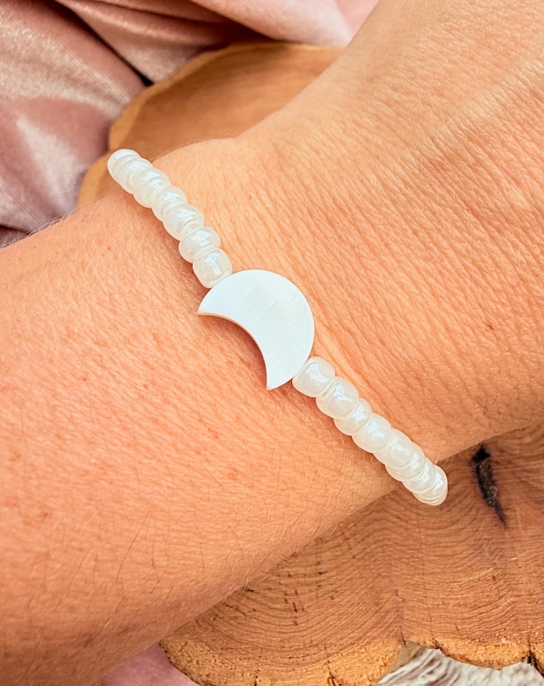 Celestial Theme Bracelet White Bead Collection Moon Shell Design Beach Style Essential Boho Fashion Element Stretch Band Construction Multiple Size Options Beautiful Casual Wear Piece Natural Fashion Detail Everyday Style Accessory