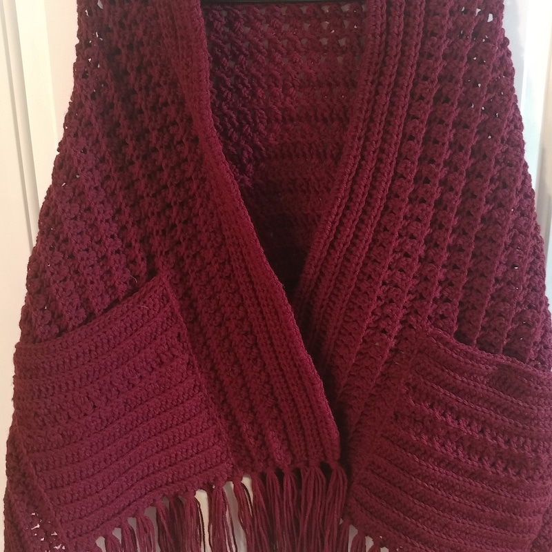a shawl with pockets