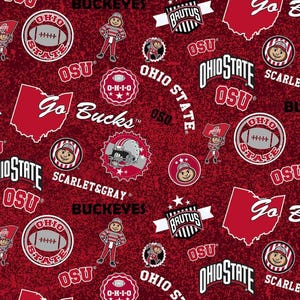 May include: A dark red fabric featuring a repeating pattern of Ohio State University graphics, including the Brutus Buckeye mascot, footballs, the state of Ohio outline, the text Go Bucks, OSU, and the Ohio State logo in white, black, and gray.
