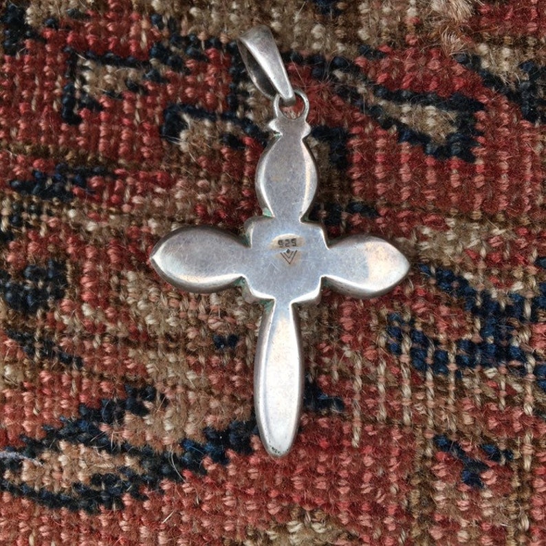 Sterling silver cross pendant with pearl center