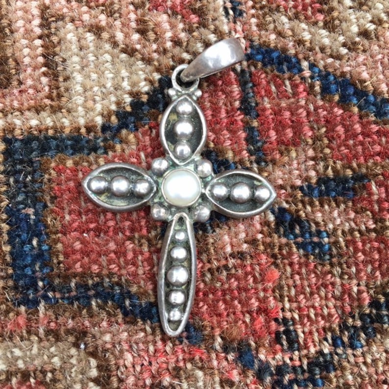 Sterling silver cross pendant with pearl center