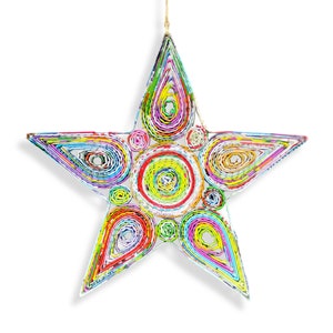 May include: A colorful star-shaped ornament made from rolled up paper. The star is decorated with circles and teardrop shapes in various colors, including red, yellow, blue, green, and purple.