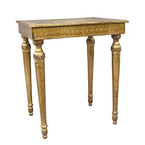 May include: A gold-painted side table with four slender, turned legs. The rectangular tabletop features decorative detailing along the edges. The table is approximately 30 inches tall.
