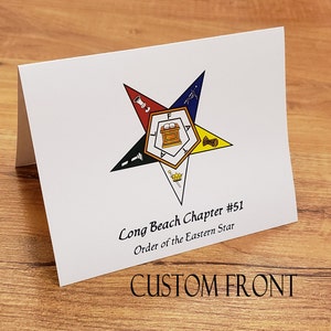 May include: White card with a five-pointed star in red, blue, yellow, and black. The star has a symbol in the center with a book and a crown. The text reads "Long Beach Chapter #51 Order of the Eastern Star".