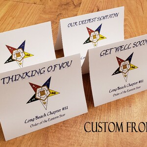 May include: Four white greeting cards with a five-pointed star design in the center. The star is red, white, blue, and yellow. The text on the cards reads "Our Deepest Sympathy", "Thinking of You", "Get Well Soon", and "Long Beach Chapter #51 Order of the Eastern Star".