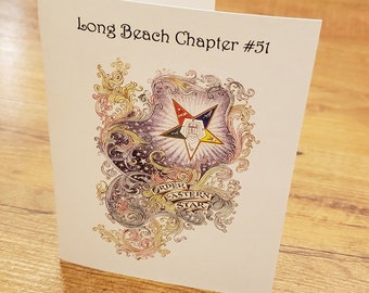 Może przedstawiać: Biała kartka z tekstem "Long Beach Chapter #51" i kolorowym obrazkiem pięcioramiennej gwiazdy z napisem "Order Eastern Star" na banerze.
