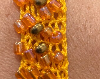 Orange crochet bling bracelet wristband with gold glass beads slip on medium jewelry