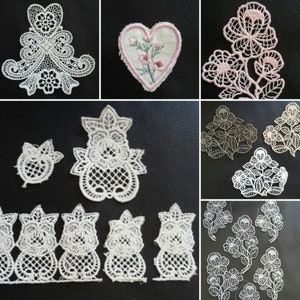 May include: A collection of white lace appliques and trims in various floral and ornamental designs. Includes a heart-shaped patch with embroidered pink flowers. The lace pieces vary in size and shape, suitable for crafting and embellishment.