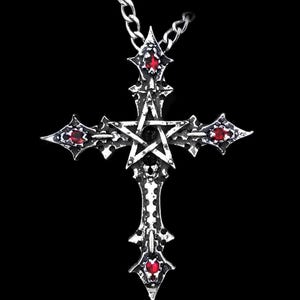 May include: A silver pendant necklace featuring a pentagram cross design. The cross has four points, each adorned with a red gemstone. The pentagram is positioned in the centre of the cross.