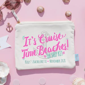 May include: A white rectangular zipped pouch featuring a pink and teal graphic of an anchor and the text It's Cruise Time Beaches! OH SHIP KIT, KELLY'S BACHELORETTE, NOVEMBER 2028. The pouch is surrounded by sunglasses, seashells, a scarf, and a bottle.
