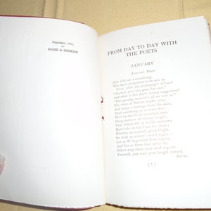 May include: A vintage book with a red cover and white pages. The title is "From Day to Day with the Poets" and the text is a poem about January.