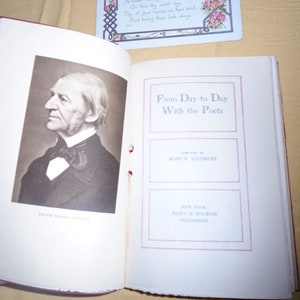 May include: An open book titled "From Day to Day With the Poets" compiled by Mary E. Salisbury. The book is published by Harper & Brothers in New York. A black and white portrait of Ralph Waldo Emerson is on the left page.