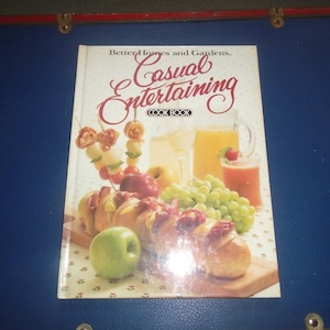 May include: A cookbook titled "Better Homes and Gardens Casual Entertaining Cookbook" with a colorful image of food and drinks on the cover.