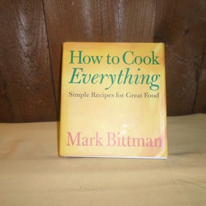 May include: A yellow and green hardcover cookbook titled "How to Cook Everything" with the subtitle "Simple Recipes for Great Food" by Mark Bittman.