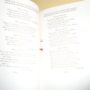 May include: An open book with white pages and a red ribbon bookmark. The pages contain a collection of poems titled "From Day to Day with the Poets" and include quotes from various poets, such as Goldsmith, Byron, Longfellow, Hood, Burns, and Emerson.