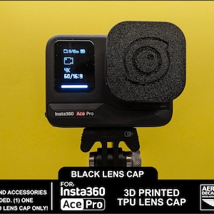 May include: A black Insta360 Ace Pro camera with a black lens cap. The camera displays a screen with blue text and icons. The lens cap is square with a textured surface and a circular design. The text "BLACK LENS CAP" is visible.