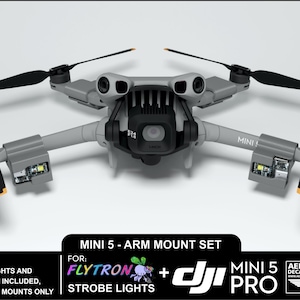 May include: A gray drone with black propellers and orange accents. The drone has the text "MINI!" on its arm. The image also includes text that reads "MINI 5 - ARM MOUNT SET" and "FLYTRON + STROBE LIGHTS".