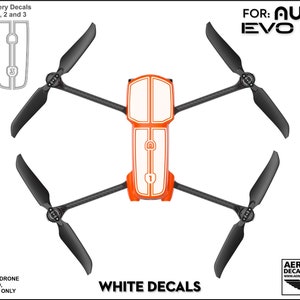 Pu&ograve; includere: Adesivi in ​​vinile bianco per un drone Autel EVO Lite+ arancione e bianco. Gli adesivi sono numerati 1, 2 e 3. PER: AUTEL EVO Lite+  ADESIVI BIANCHI AERIAL-PIXEL DECALS & APPAREL WWW.AERIAL-PIXEL.COM/DRONEPILOTS
