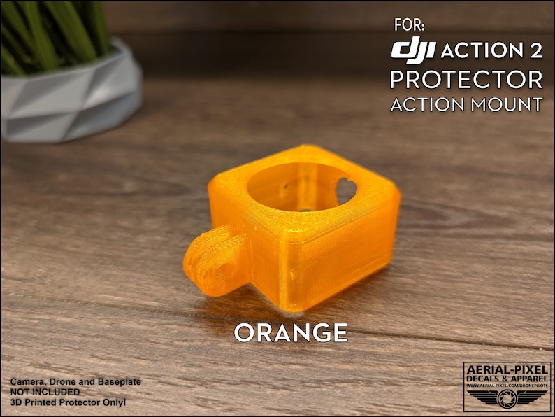 May include: Orange 3D printed protector for a DJI Action 2 camera. The protector is designed to mount to the camera's action mount.  FOR: DJI ACTION 2 PROTECTOR ACTION MOUNT