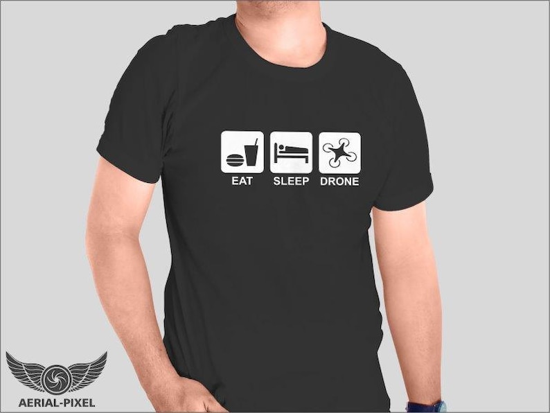 May include: Black t-shirt with white text and icons that say "Eat, Sleep, Drone".