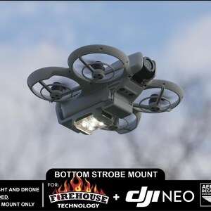May include: A 3D printed mount for a DJI Neo drone, designed to hold a strobe light. The mount is gray and has a clear plastic cover over the light. The text "BOTTOM STROBE MOUNT" is visible in the image. The text "FOR: FIREHOUSE TECHNOLOGY + DJI NEO" is also visible in the image.
