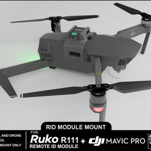 May include: 3D printed mount for a DJI Mavic Pro drone, designed to hold a Ruko R111+ Remote ID Module. The mount is grey and has a black and gold drone in the background.