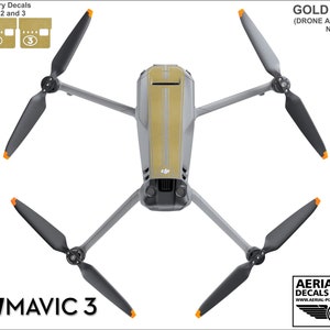 May include: Gold decals for a DJI Mavic 3 drone. The decals are in a gold color and have a black and white stripe design. The decals are for the drone body and the batteries. The drone and batteries are not included.