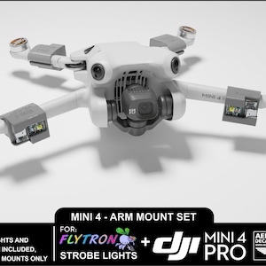 May include: White 3D printed drone arm mounts for DJI Mini 4 Pro drone with strobe lights. The mounts are designed to fit the drone's arms and allow for the attachment of strobe lights. The text "FLYTRON + STROBE LIGHTS" is visible on the image.