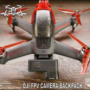 May include: A red and gray DJI FPV drone with red propellers and a black GoPro camera mount. The text "DJI FPV CAMERA BACKPACK" is printed on the image.