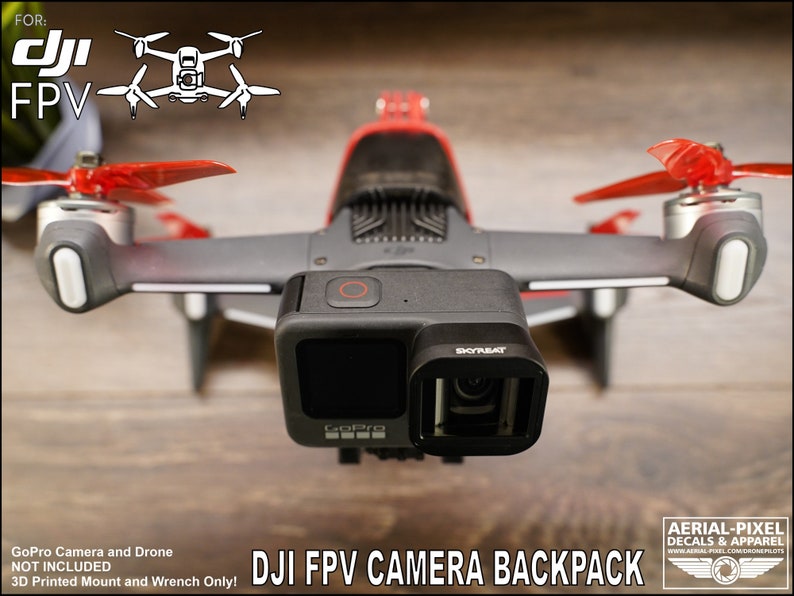 May include: A 3D printed mount for a GoPro camera to be attached to a DJI FPV drone. The text "DJI FPV CAMERA BACKPACK" is printed below the drone. The text "GoPro Camera and Drone NOT INCLUDED 3D Printed Mount and Wrench Only!" is printed below the image.
