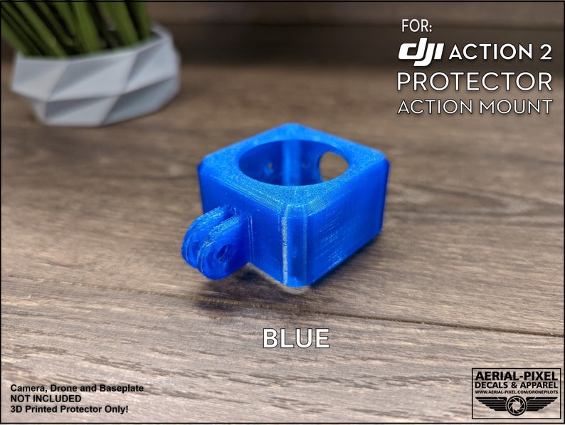 May include: Blue 3D printed protector for a DJI Action 2 camera. The protector is a square shape with a round opening for the camera lens. It has a GoPro-style mount on the bottom.  FOR: DJI ACTION 2 PROTECTOR ACTION MOUNT