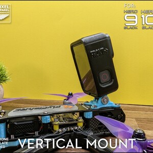 May include: A black GoPro camera mounted on a drone with purple propellers. The mount is blue and the text "VERTICAL MOUNT" is visible. The image also includes the text "HERO 9 10 11 BLACK BLACK BLACK".