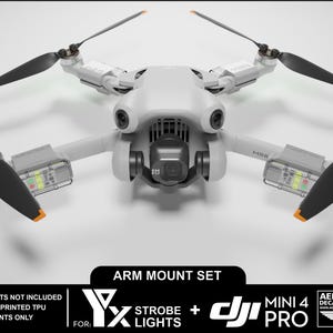 May include: A white drone with black propellers and orange accents. The drone has a camera and is labeled "MINI 4 PRO". The image includes text that reads "ARM MOUNT SET" and "STROBE LIGHTS NOT INCLUDED".