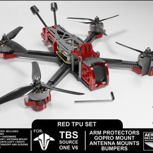 May include: A red and black drone with four propellers. The drone has a red TPU set and includes arm protectors, a GoPro mount, antenna mounts, and bumpers. The image also includes the text "V6 Version".