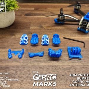 May include: A set of blue 3D printed parts for a drone, including arm protectors, bumpers, a GoPro mount, and antenna mounts. The parts are labeled "GEPRO MARK5".