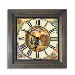 May include: Square wall clock with a rustic wooden frame. The clock face features a pastoral scene with a horse, a caravan, and a campfire. Roman numerals mark the hours. The clock hands are black.