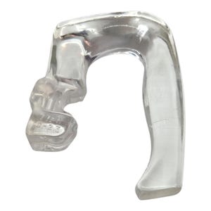 May include: A clear, curved glass object with a rounded handle and a textured base. The base has the etched text "37-H" and "6-23". The object is likely a handle or part of a larger piece of glassware.