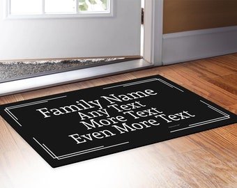 May include: Black doormat with white text that reads "Family Name Any Text More Text Even More Text".