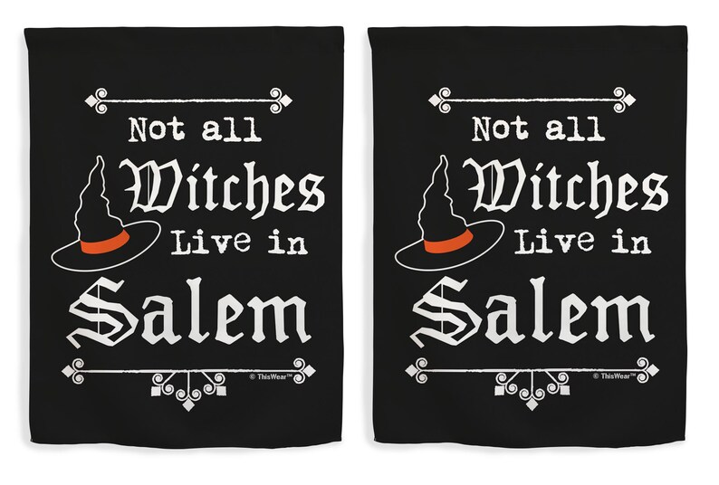 May include: Two black decorative flags with white text and a witch hat graphic. The text reads "Not all Witches Live in Salem". The witch hat is black with an orange band. Decorative elements are at the top and bottom.