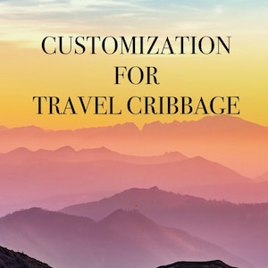 May include: A scenic landscape with layers of purple mountains under a gradient sky of blue, yellow, and orange. The text "CUSTOMIZATION FOR TRAVEL CRIBBAGE" is displayed in black, centered at the top.