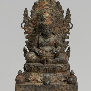 May include: A bronze statue of a seated Buddha figure with a decorative halo and a lotus base. The statue has a weathered, aged appearance.