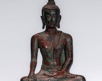 May include: A bronze statue of a seated Buddha with a pointed crown and a green patina. The statue is in a meditative pose with hands resting in the lap.